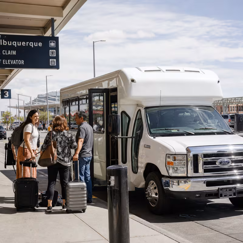 Black Mercedes Sprinter van staged for an Albuquerque Airport Transportation group