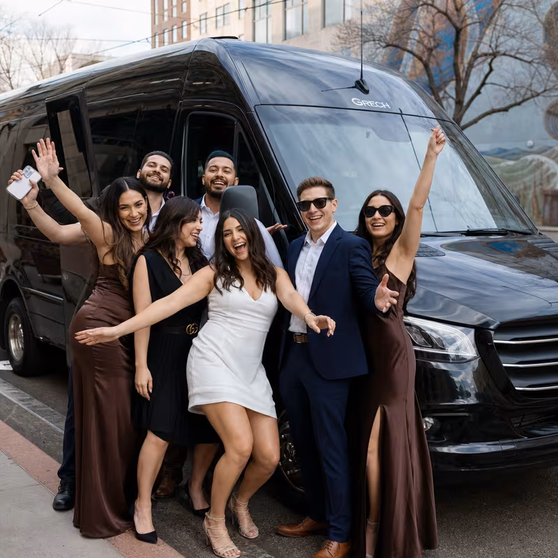 Group boarding a white charter bus for Bachelor & Bachelorette Transportation transportation in Albuquerque