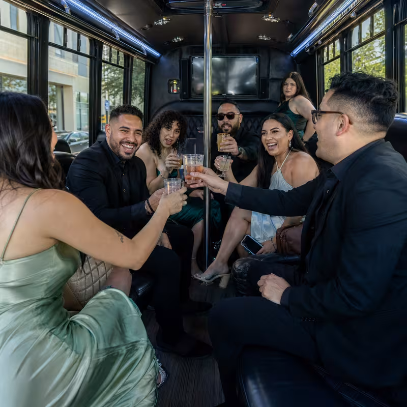 Party bus interior with wraparound leather seating and LED lighting in Albuquerque
