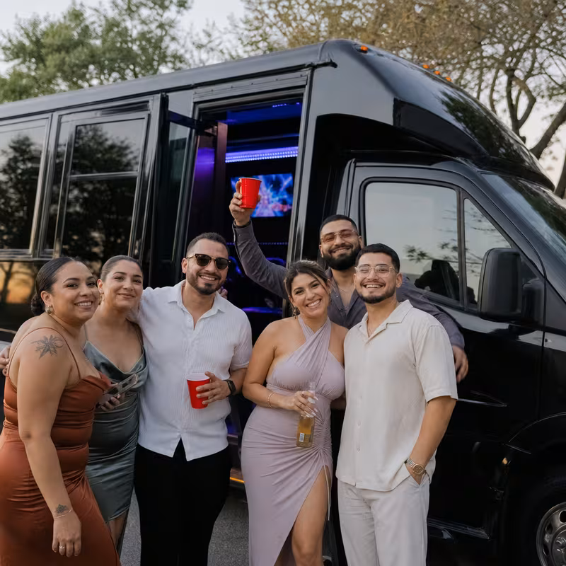 Party bus interior with wraparound leather seating and LED lighting in Albuquerque