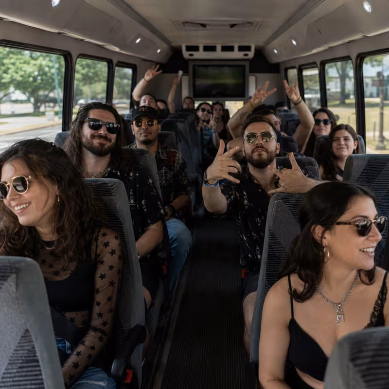 Party bus interior with wraparound leather seating and LED lighting in Albuquerque