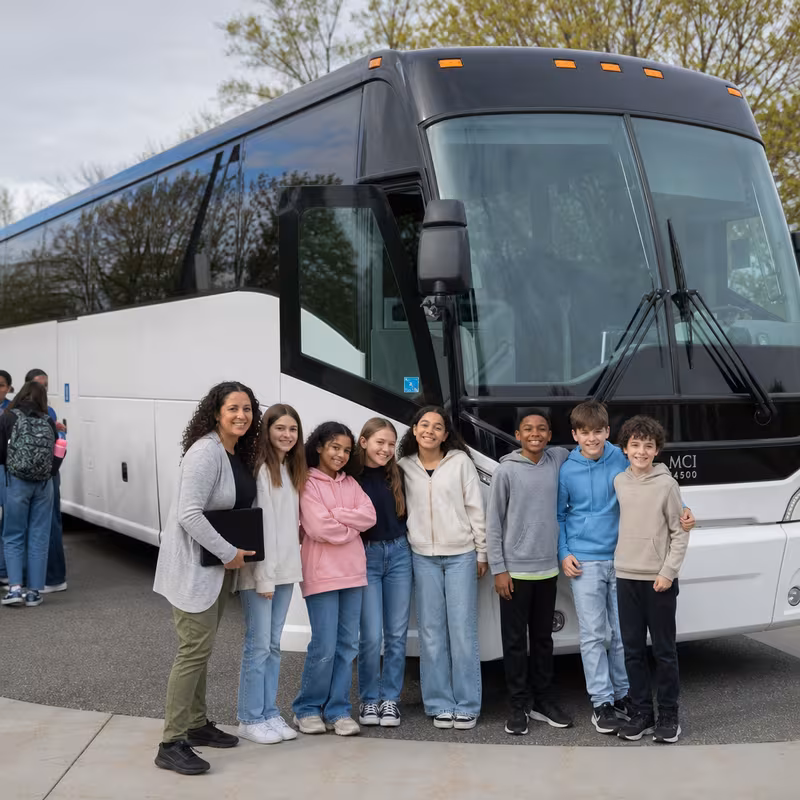 Passengers loading luggage while boarding an Albuquerque group shuttle